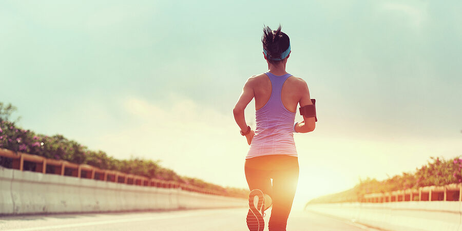 young fitness woman runner running on city road,vintage effect